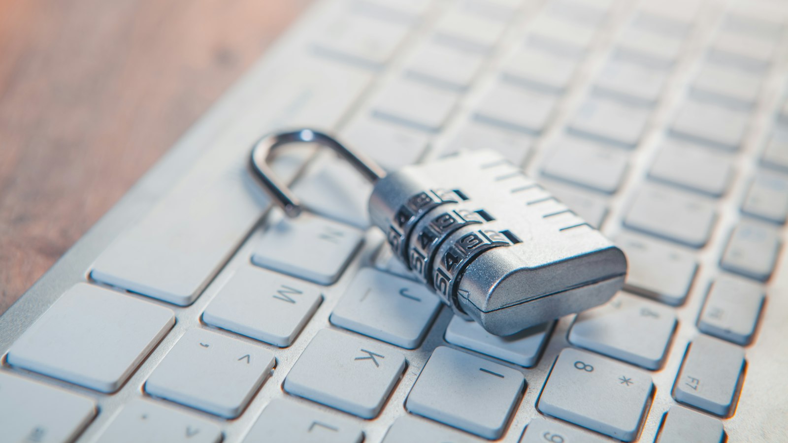 A combination lock resting on a computer keyboard